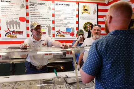 On Patriot Sandwich Co.'s reopening day, owner David Jordan (on left) and volunteers Jocelyn...