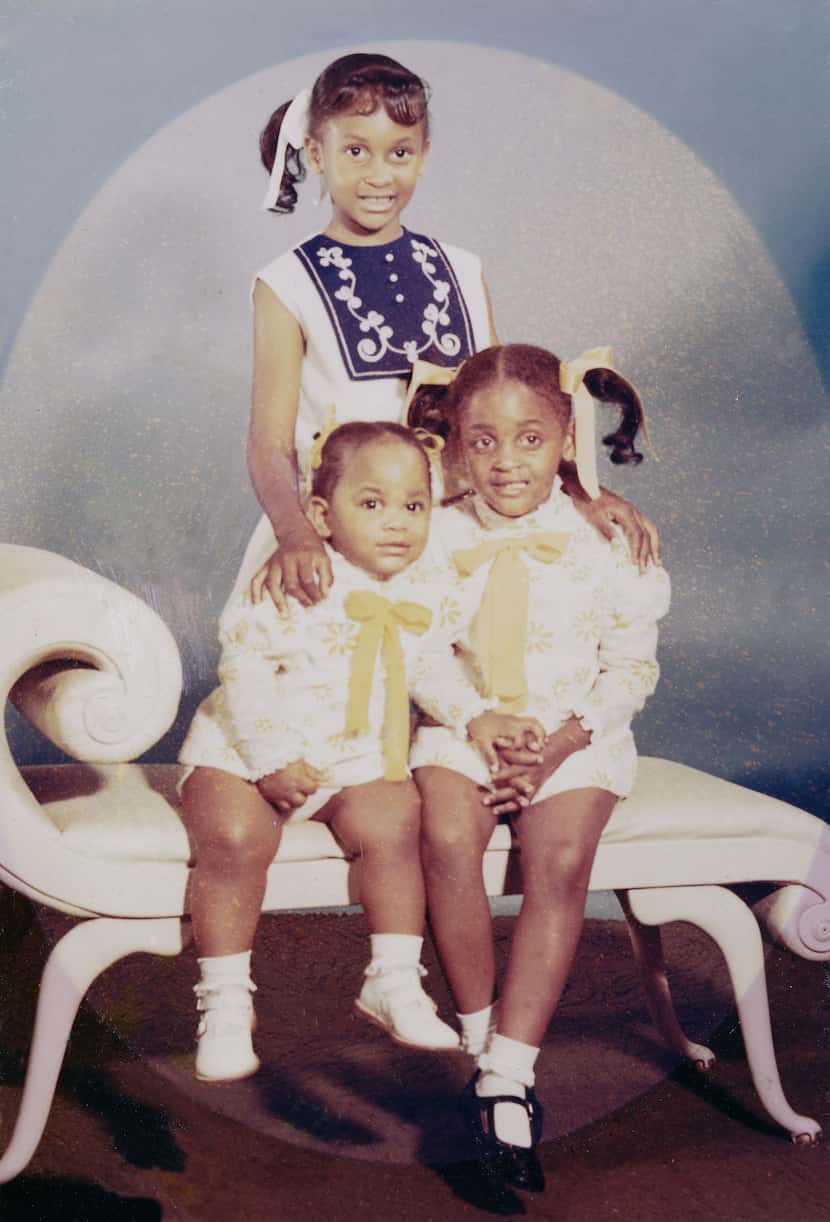Pettis Norman's three daughters. Shawn (standing) and Sedonna sitting next to Shandra, the...