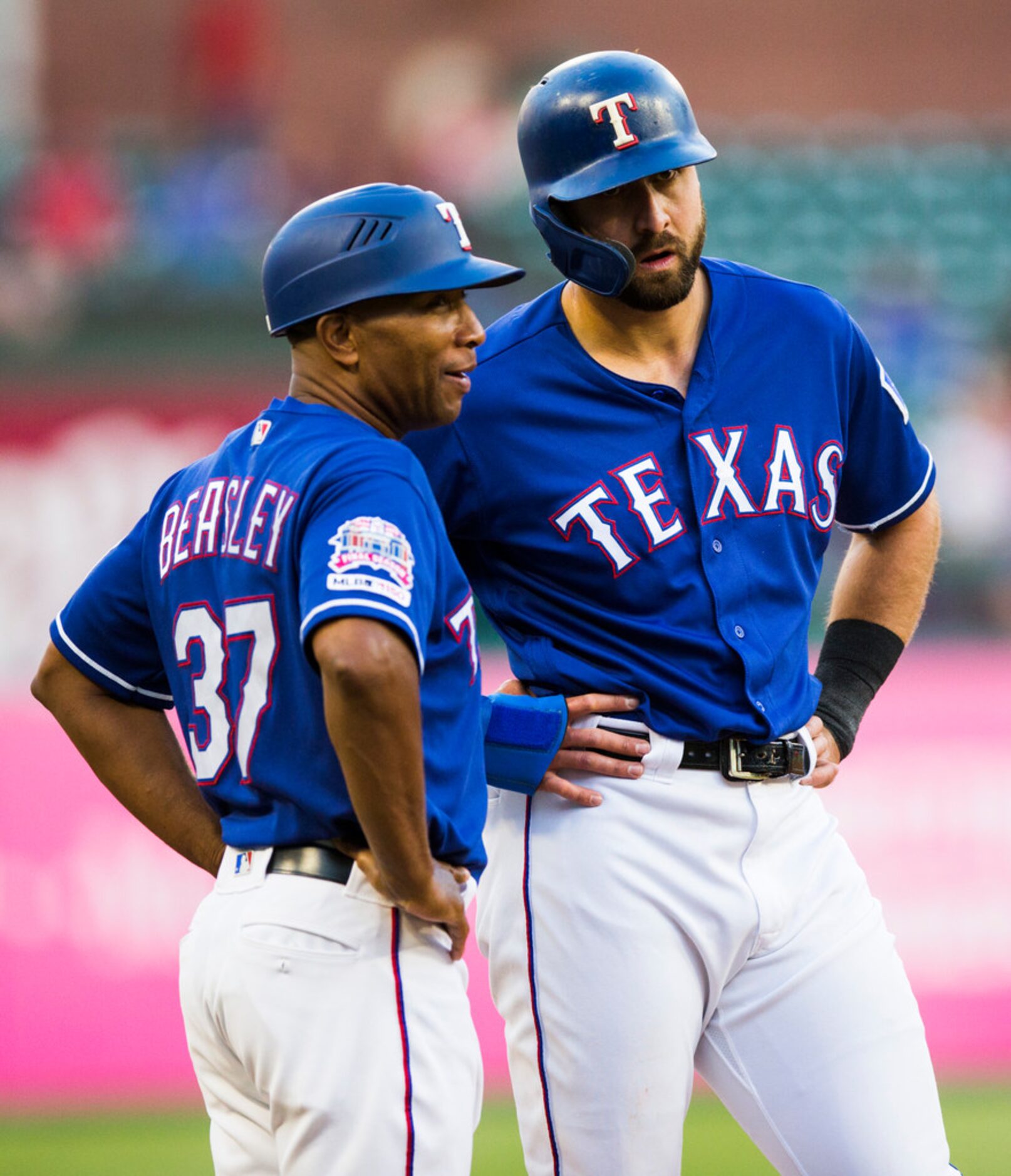 Texas Rangers center fielder Joey Gallo (13) chats with third base coach Tony Beasley (37)...