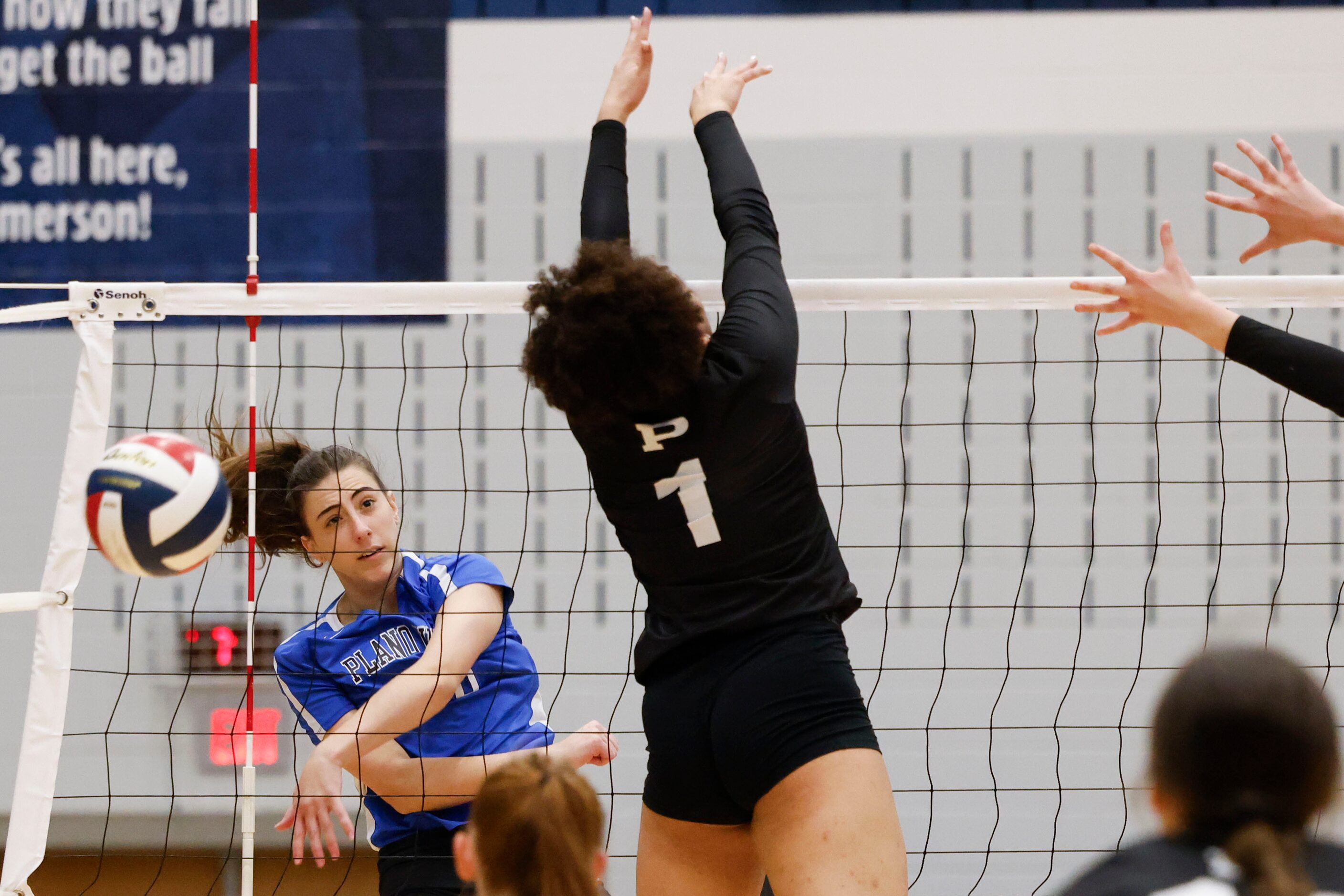 Plano West’s Kat Janise spikes the ball against Prosper High Jayla Jackson (right) during...