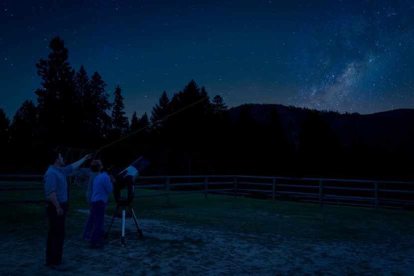 Guests at the Triple Creek Ranch find a secluded spot for stargazing, with the center of the...