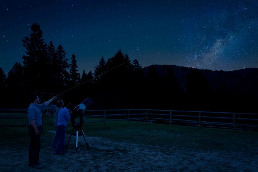 Guests at the Triple Creek Ranch find a secluded spot for stargazing, with the center of the...