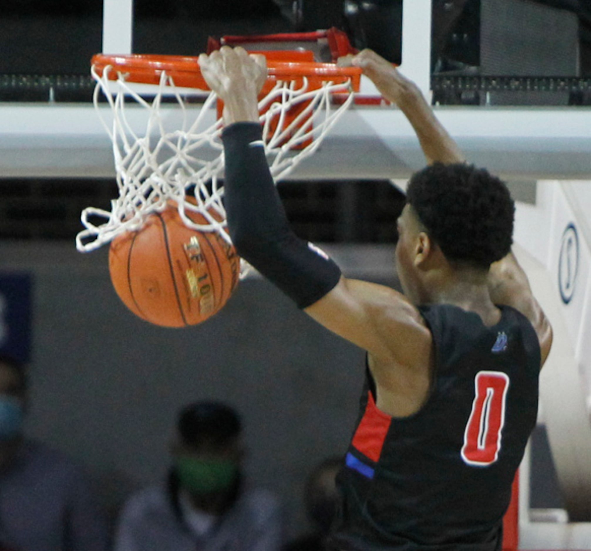 Duncanville guard Zhuric Phelps (0) finishes a fast break with flair during first half...