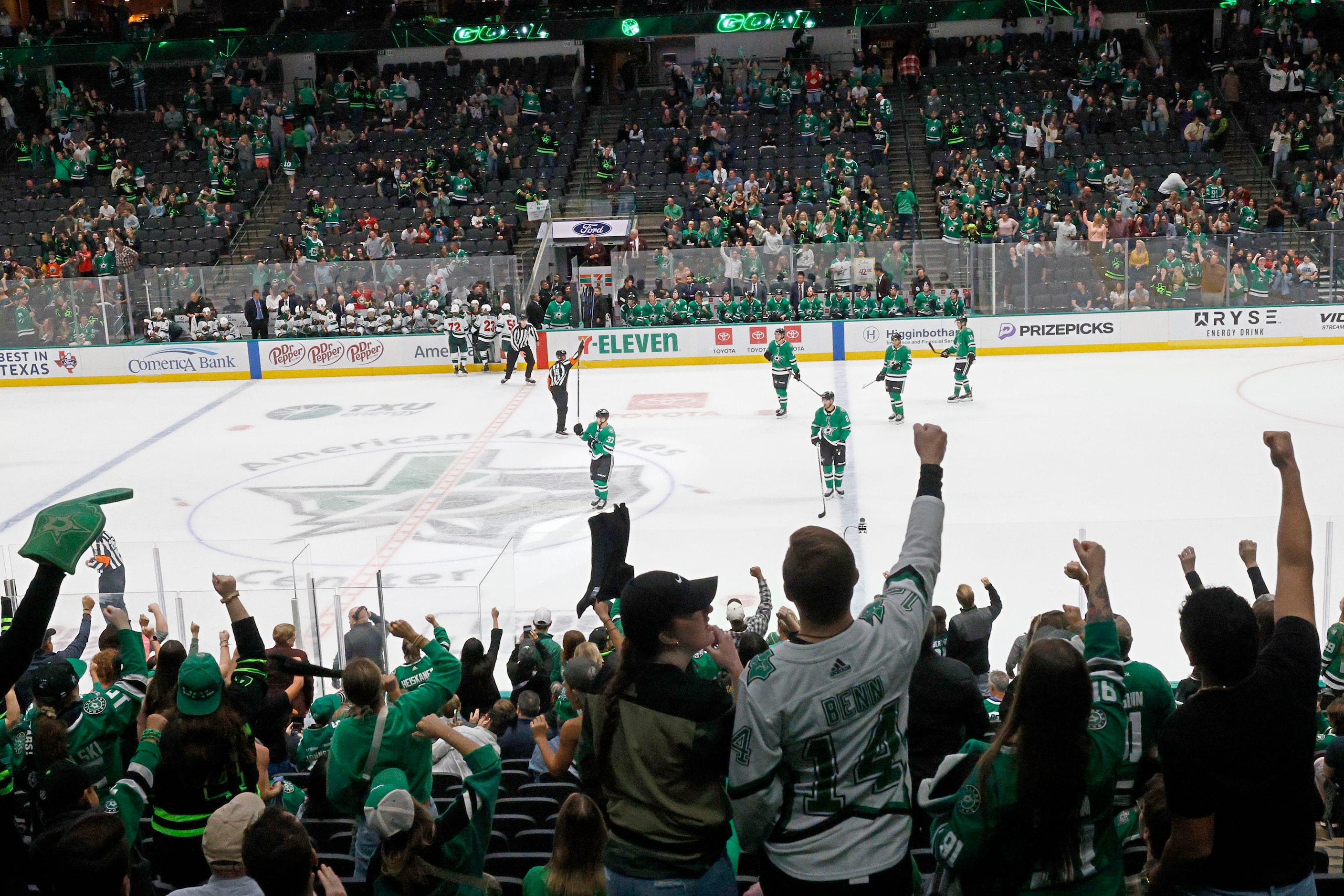 Fans cheer as Dallas Stars center Emilio Pettersen (37) scores a goal against Minnesota Wild...