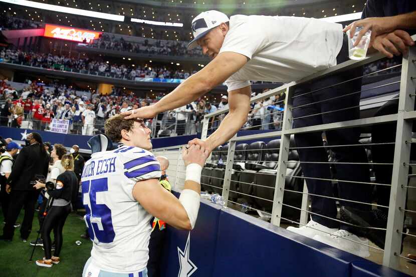 Dallas Cowboys outside linebacker Leighton Vander Esch (55) is consoled by his father Darwin...