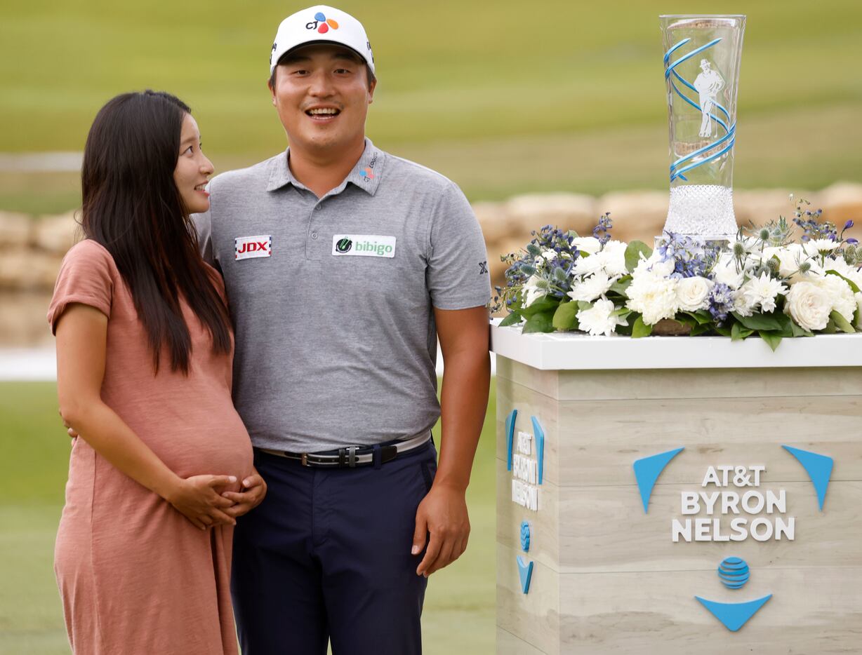 Kyoung-Hoon Lee and his wife Julie (left) during the trophy presentation after winning the...