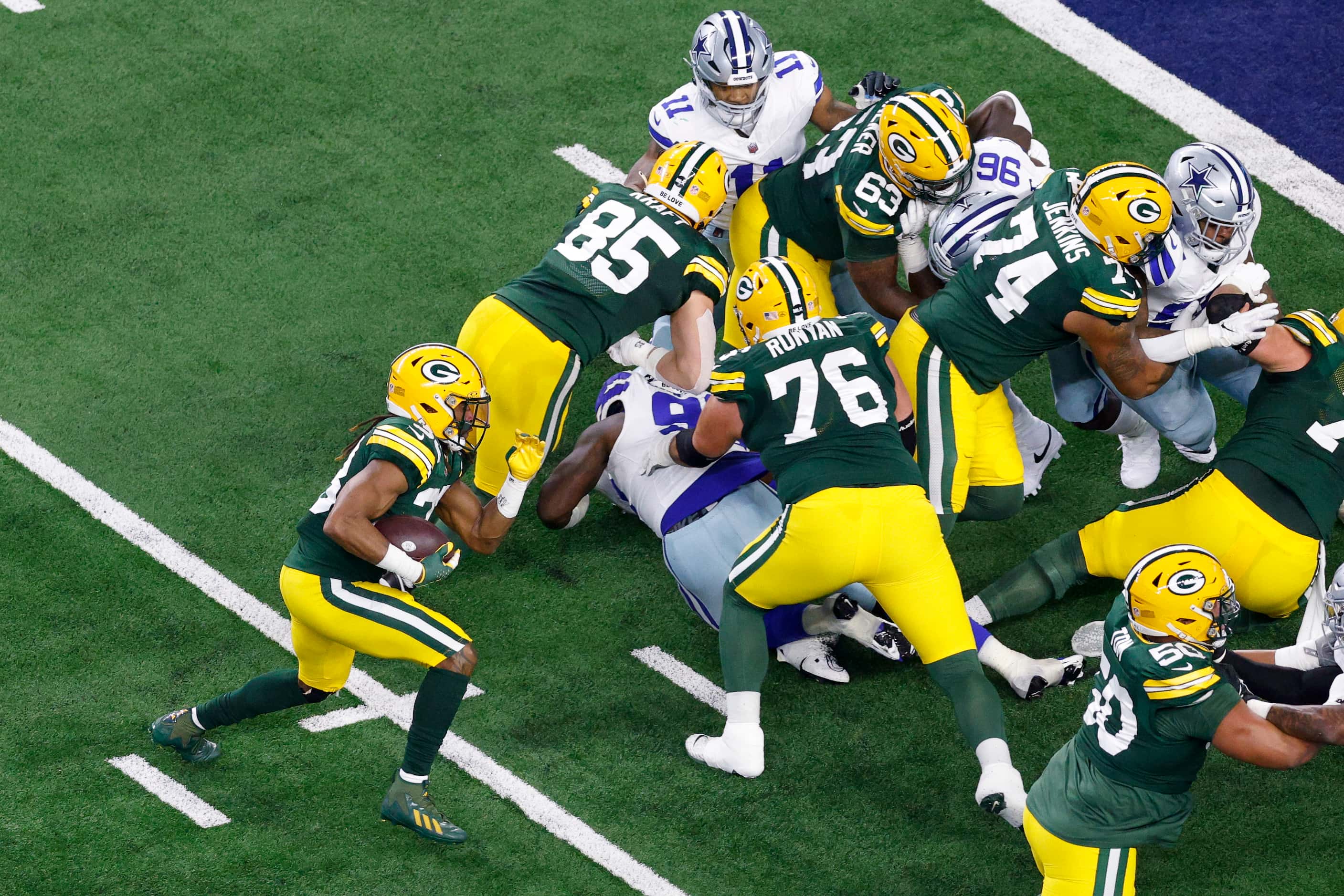 Green Bay Packers running back Aaron Jones (33) rushes for a touchdown during the first half...