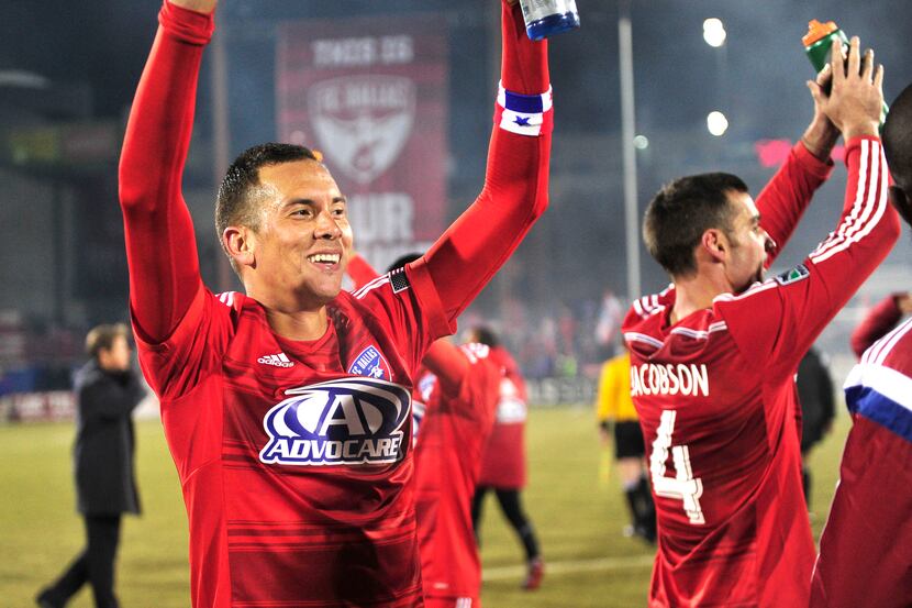 FC Dallas's Blas Pérez (left) and Andrew Jacobson cheer for the crowd after defeating...