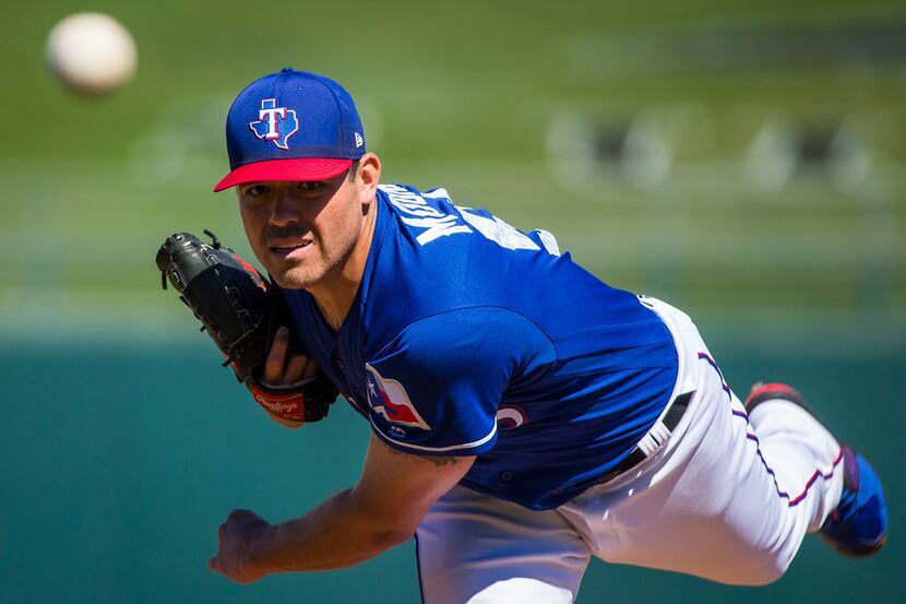 Texas Rangers pitcher Matt Moore pitches during the first inning of a spring training...