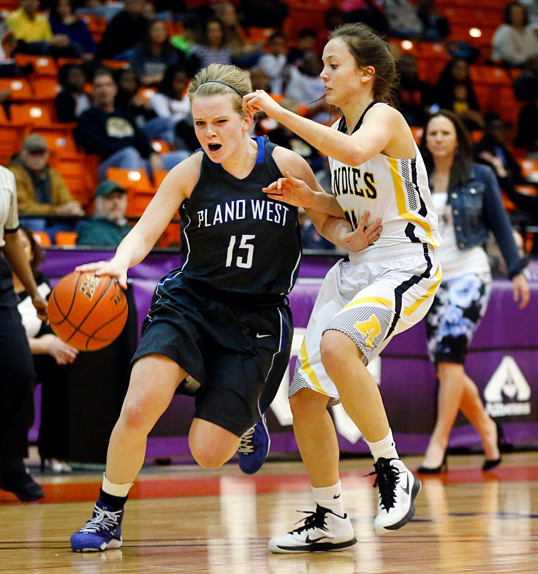 Plano West guard Morgann Yancey (15)  dribbles past Amarillo wing Ashlyn Hoover (14) in the...