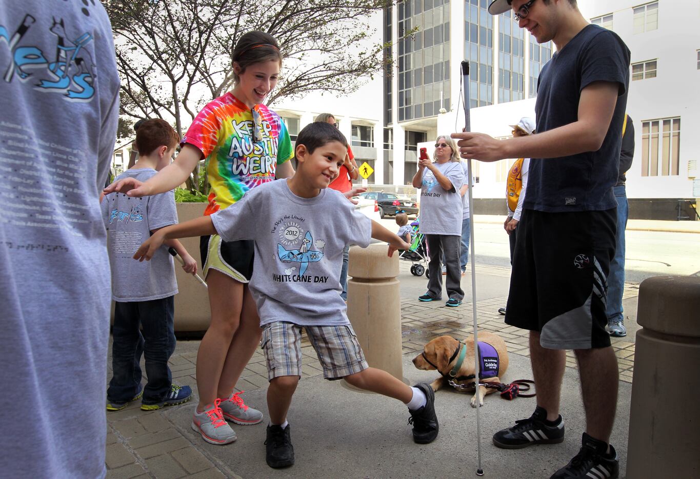 Zach Thibodeaux dances in front of Fort Worth City Hall while he participates in fourth...