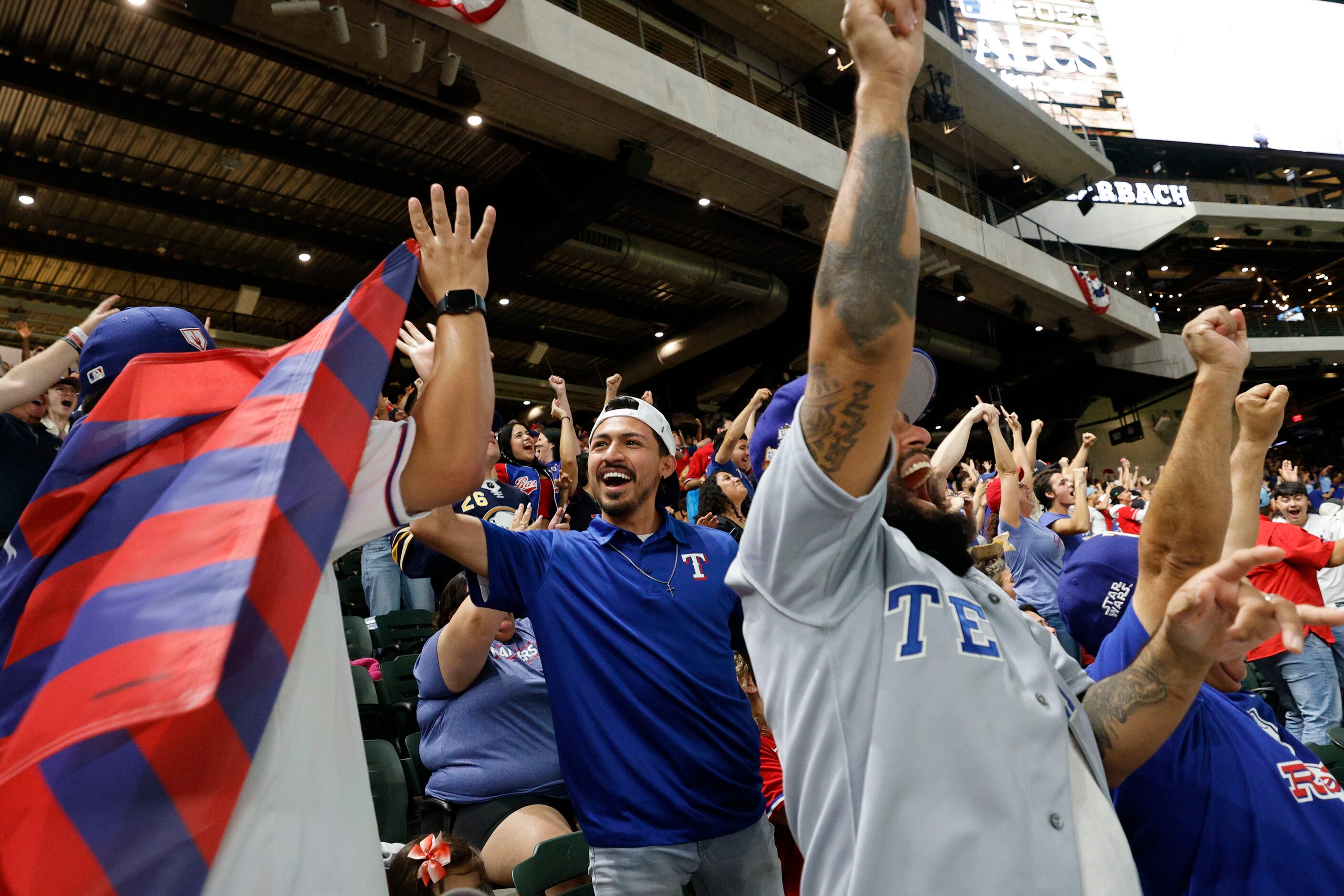 Texas Rangers fans react during a Game 7 watch party of the baseball American League...