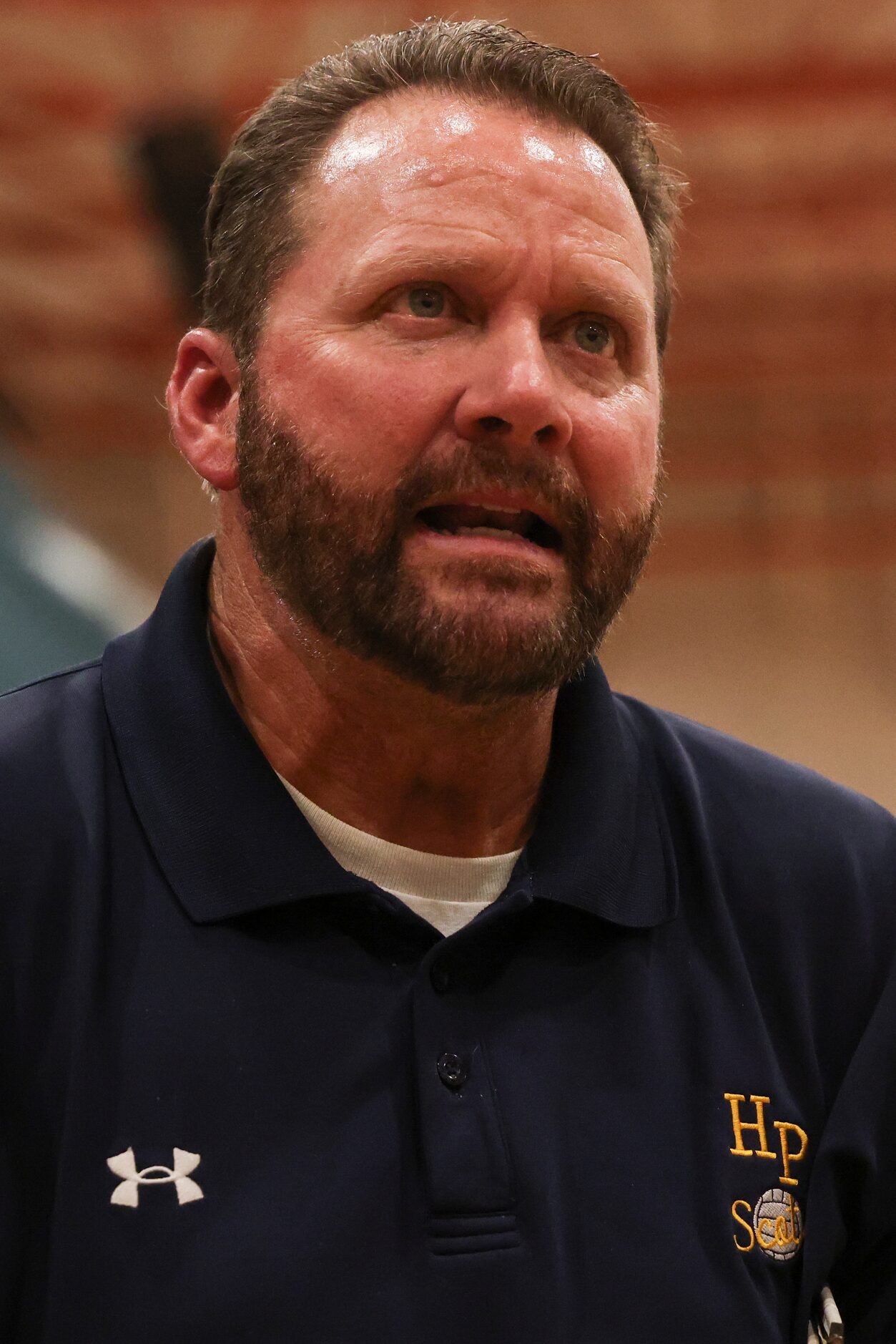 Highland Park Head Coach Michael Dearman talks to the team in between sets during the...