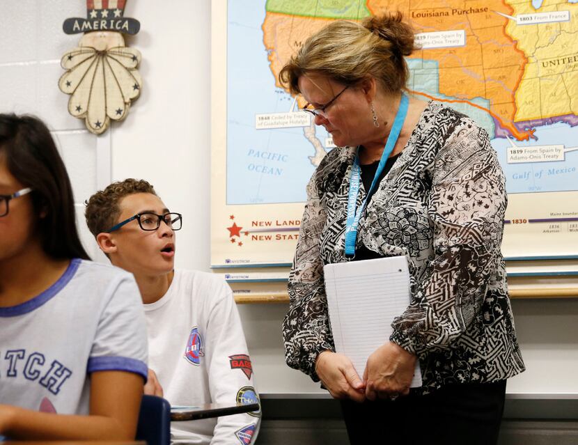 Eighth-grade teacher Joan Brandt talks with Reed Roberts, 13, at Kleb Intermediate School in...