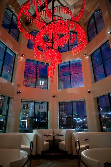 The restaurant has recognizeable red art hanging inside.