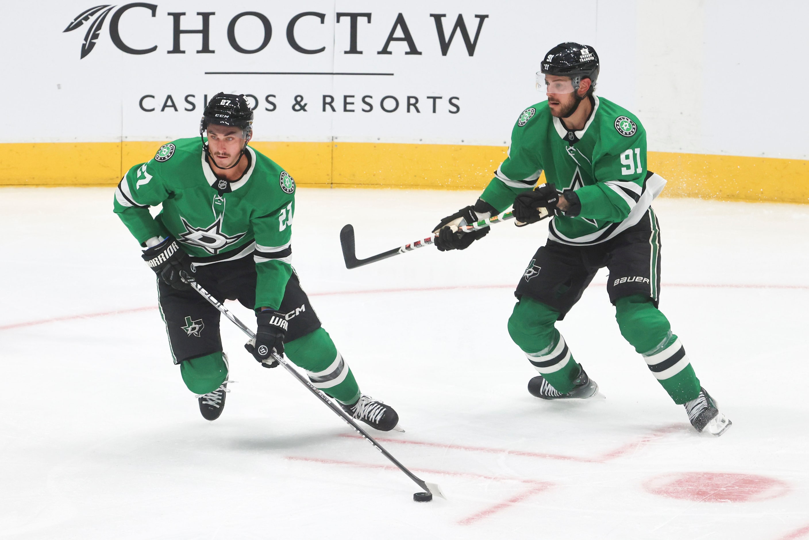 Dallas Stars left wing Mason Marchment (left) goes down the rink during the second period of...