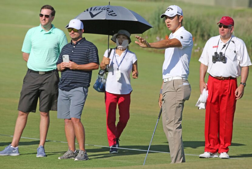 Sangmoon Bae gestures as he hits onto the green onNo. 15 at the 2018 AT&T Byron Nelson...