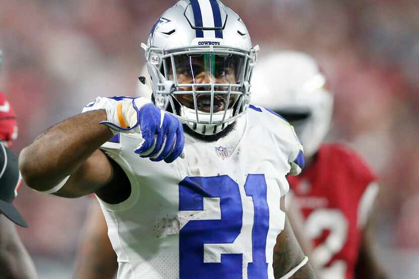 Dallas Cowboys running back Ezekiel Elliott (21) signals his "feed me," sign after a first...