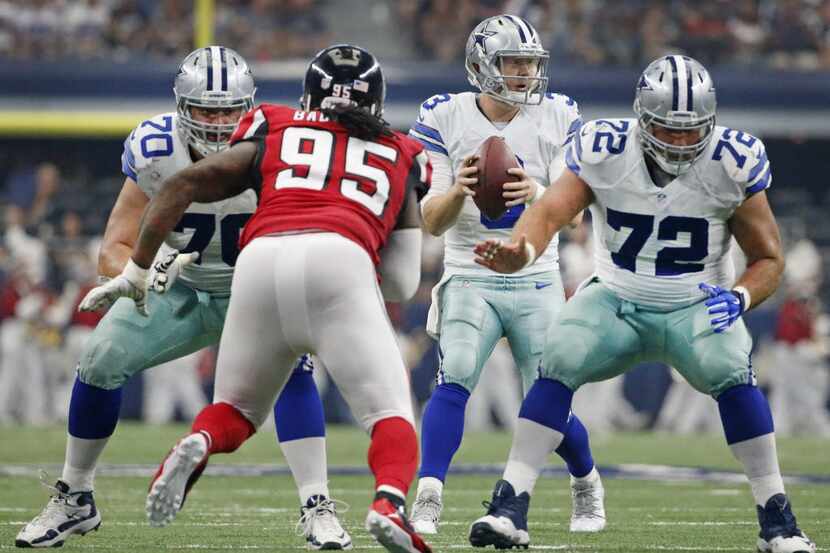 Dallas Cowboys quarterback Brandon Weeden (3) takes the snap as guard Zack Martin (70) and...
