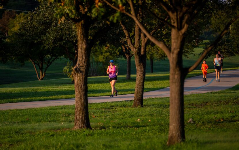 Amie Goins, left, runs a 5k at at the Josey Ranch Athletic Complex in Carrollton.