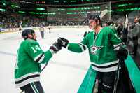 Dallas Stars left wing Jamie Benn (14) celebrates with left wing Mason Marchment (27) after...