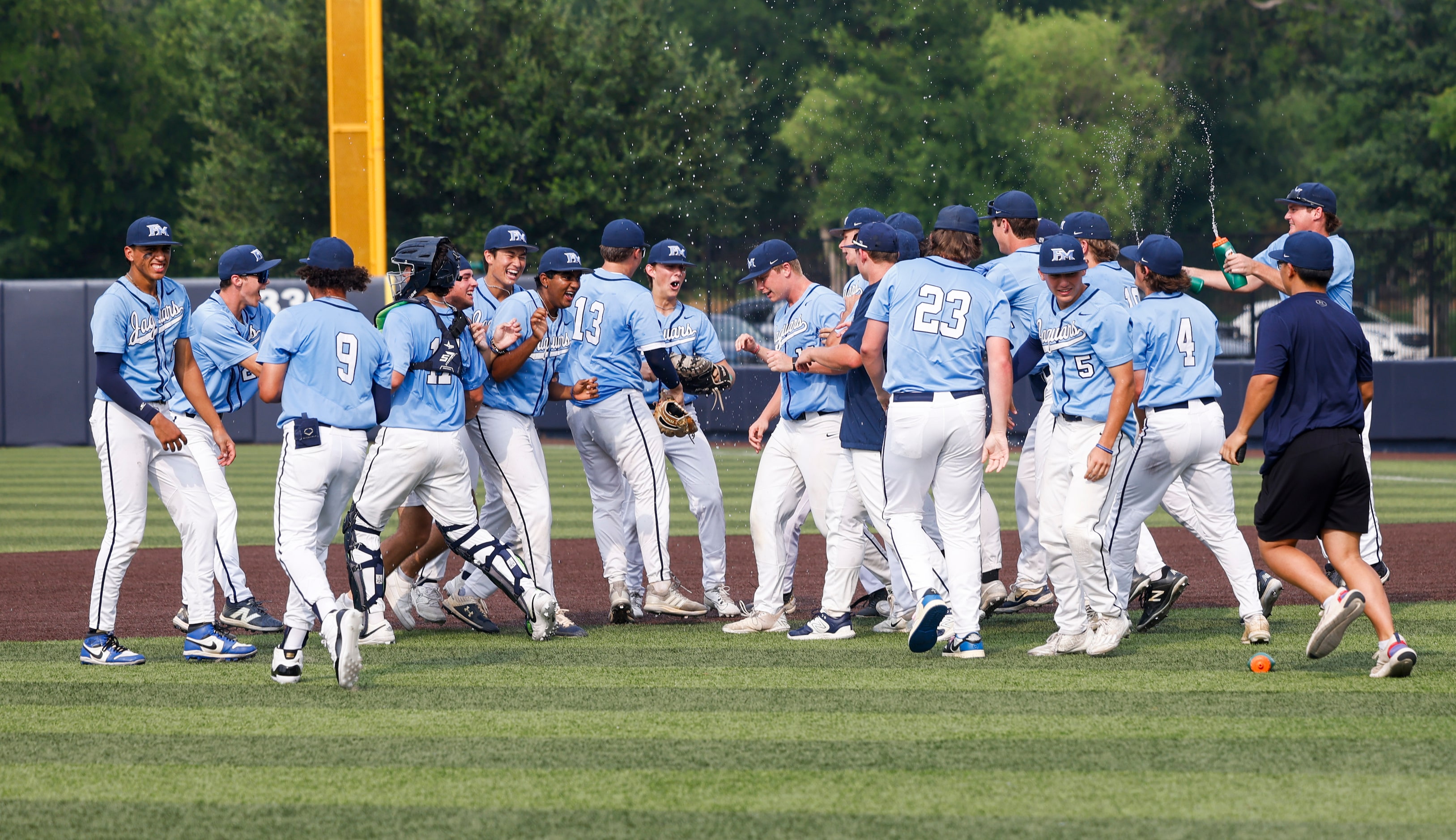 Flower Mound players celebrate after Game 3 of a best-of-3 Class 6A Region I semifinal...