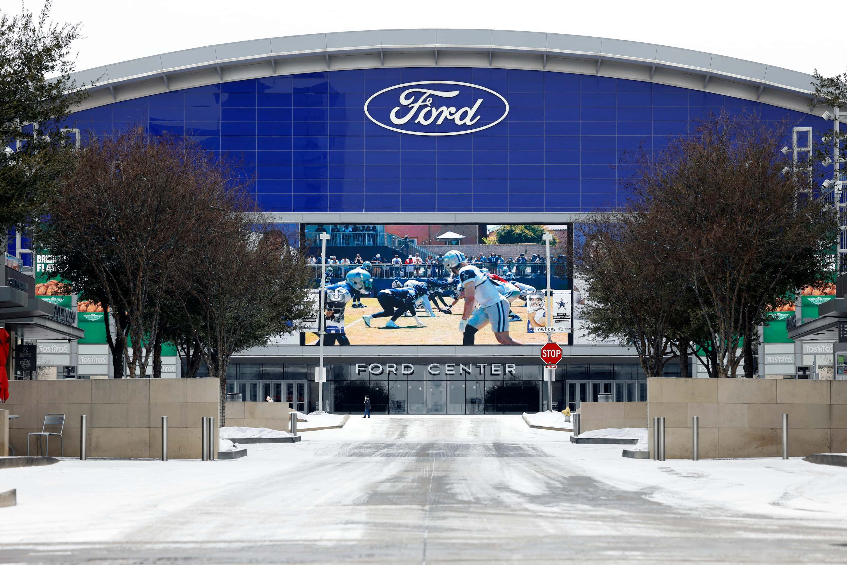 Snow covers the ground outside the Ford Center, Monday, Jan. 15, 2024, in Frisco, Texas....