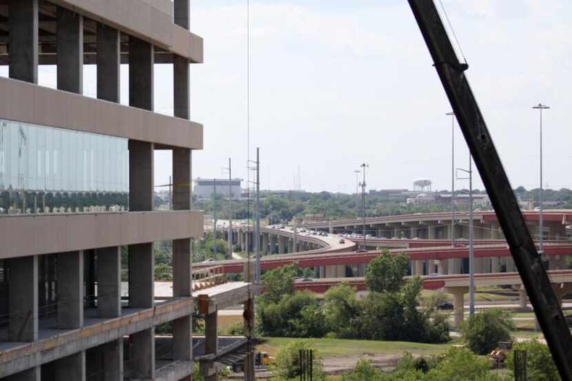 
Work on State Farm’s headquarters complex in Richardson continued last year near DART’s...