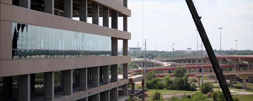 
Work on State Farm’s headquarters complex in Richardson continued last year near DART’s...