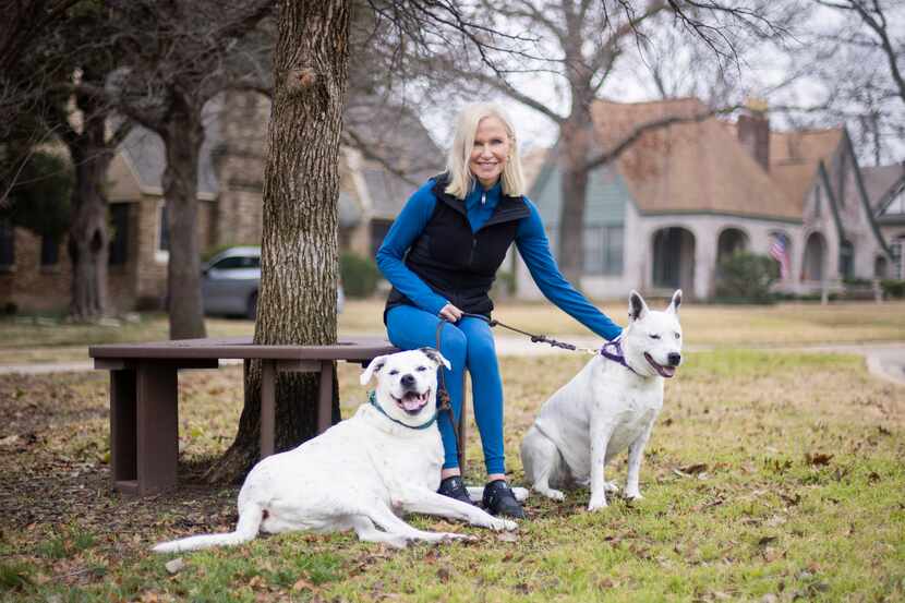 Susan Hawk with her dogs, Murray (left) and Dickens near their Lakewood home. After Hawk...