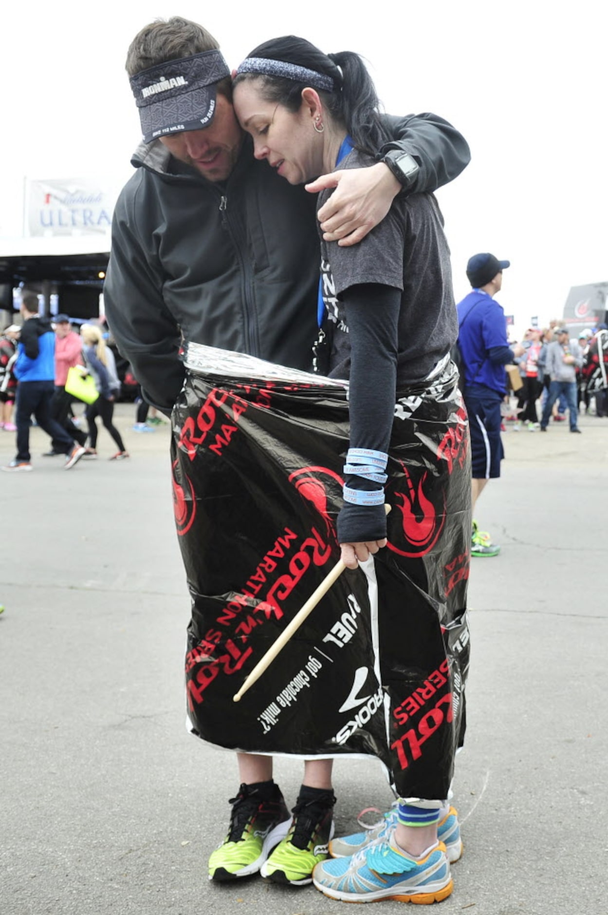 Karen Soltero gets a hug from her boyfriend Greg Barnes after they finished walking the last...