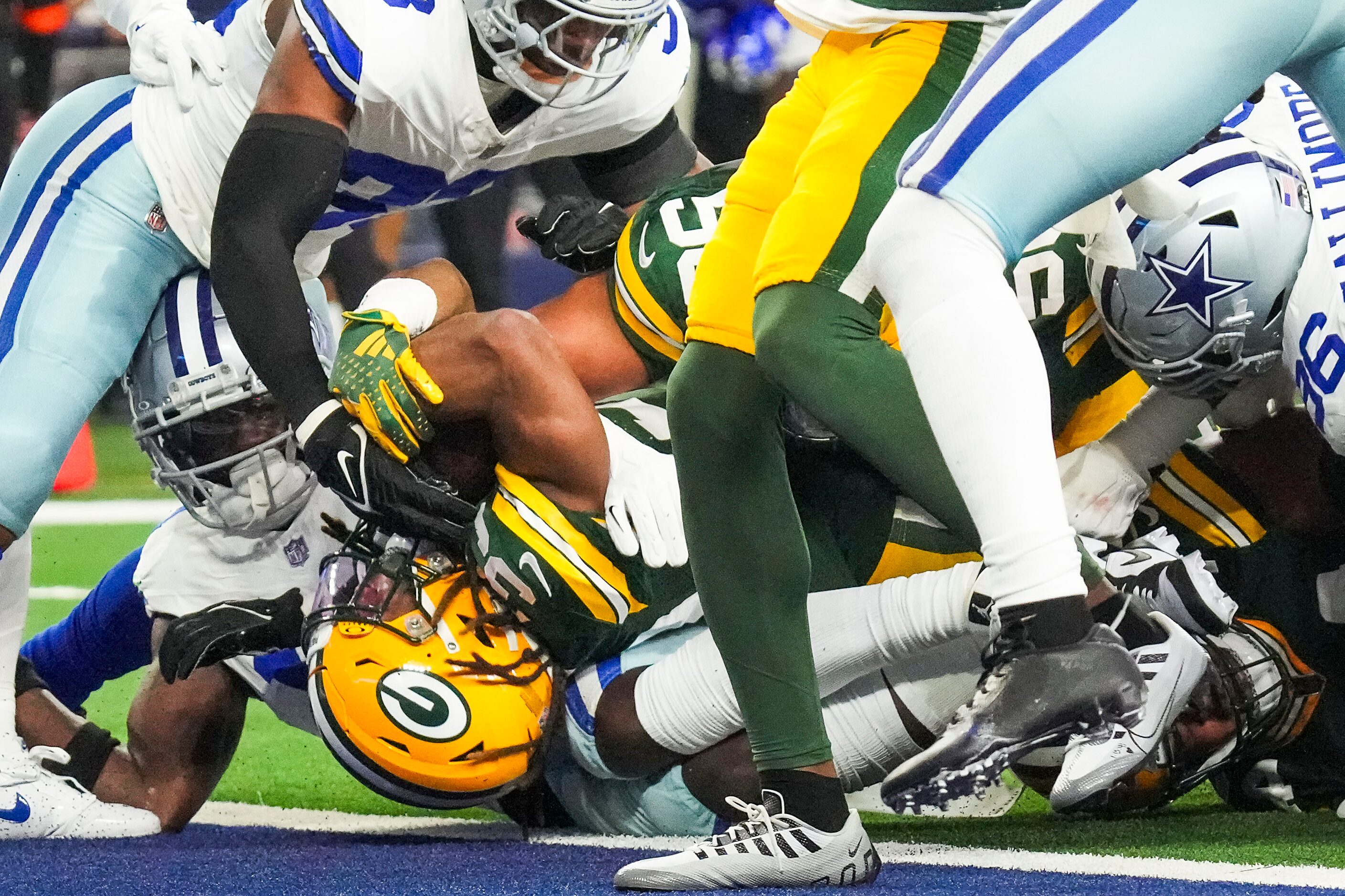 Green Bay Packers running back Aaron Jones (33) scores on a touchdown  run during the first...