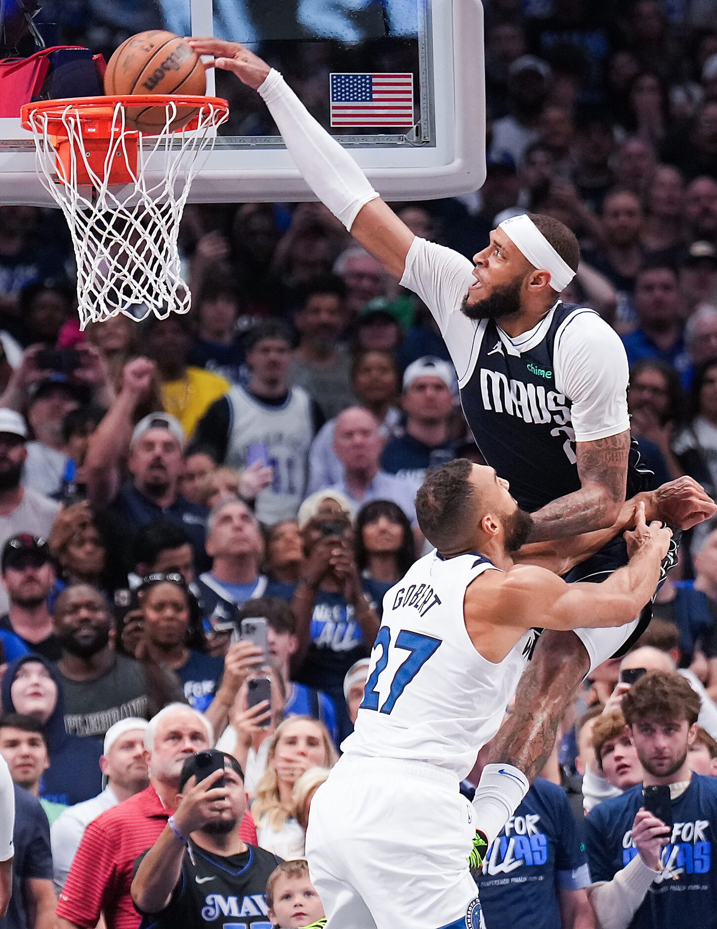 Dallas Mavericks center Daniel Gafford (21) dunks on Minnesota Timberwolves center Rudy...