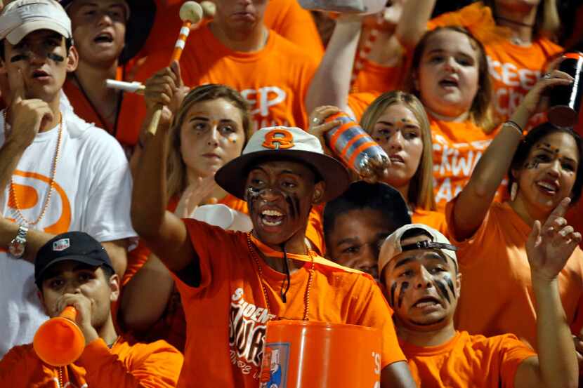 Rockwall fan Jarrod Winston, with drumstick) and the rest of the student section celebrate a...