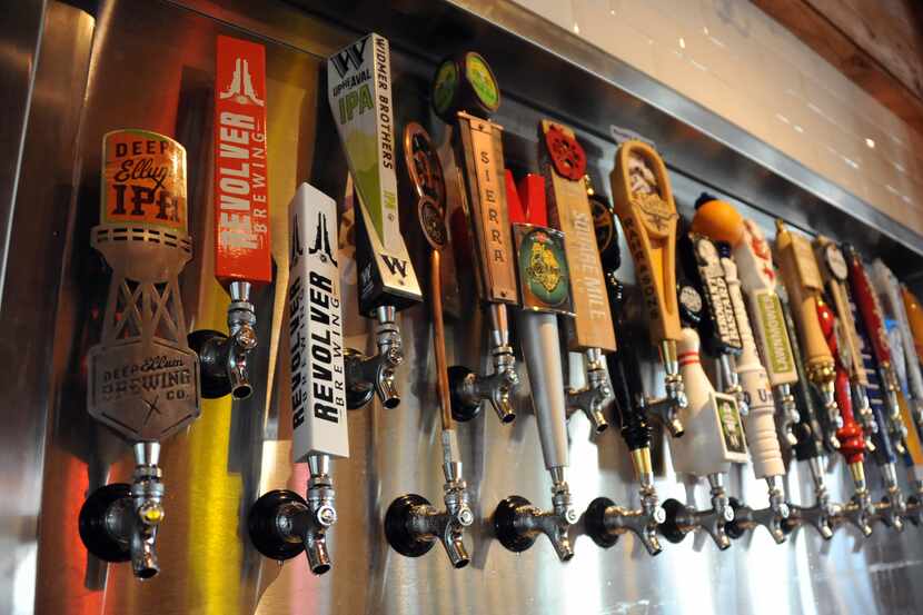 The bar at Ten 50 BBQ features 24 craft beers on tap including eight local brews .