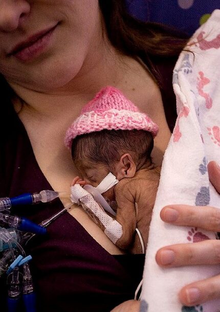 Kelley French holding Juniper, then two weeks old.