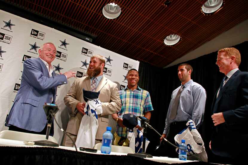 (From left) Jerry Jones, Dallas Cowboys owner and general manager, jokes with the draft...