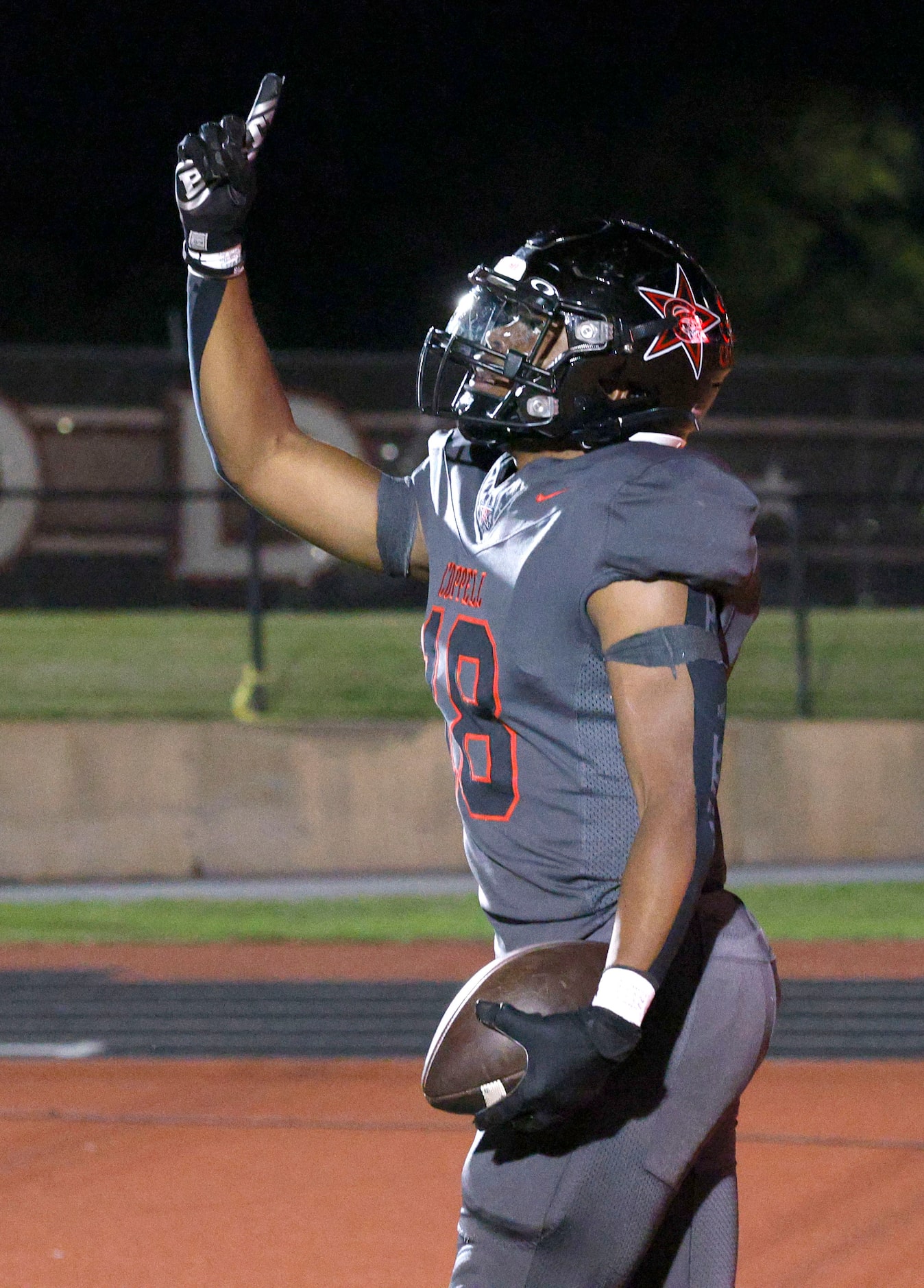 Coppell's Josh Lock (18) celebrates after scoring a touchdown against Prosper in the second...