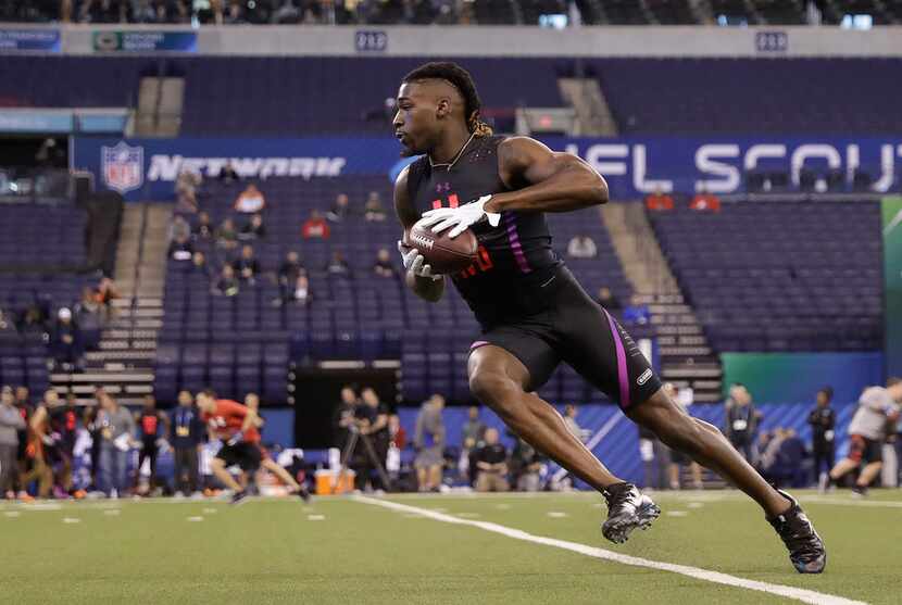 Clemson wide receiver Deon Cain runs a drill during the NFL football scouting combine,...