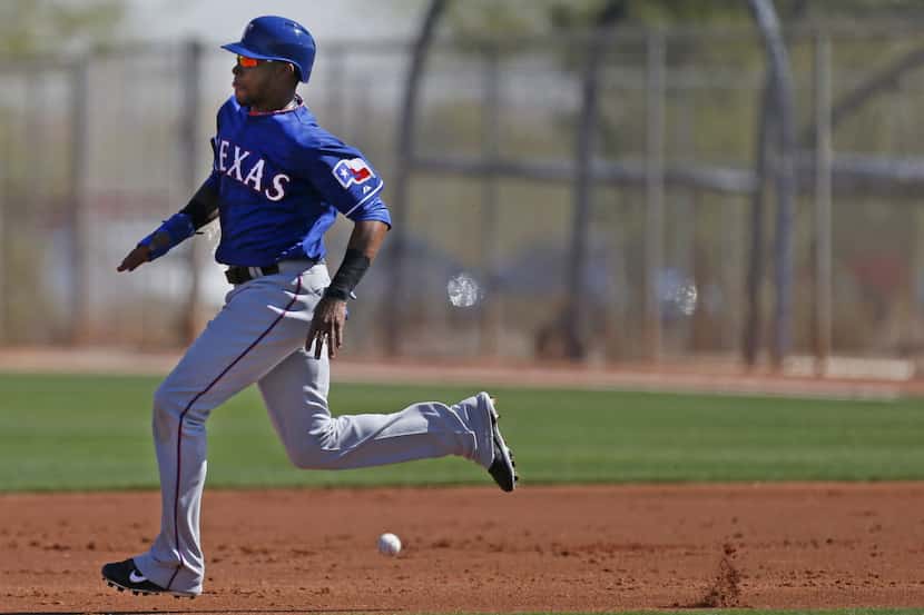 Texas outfielder Engel Beltre breaks for second on a hit-and-run during an intrasquad game...