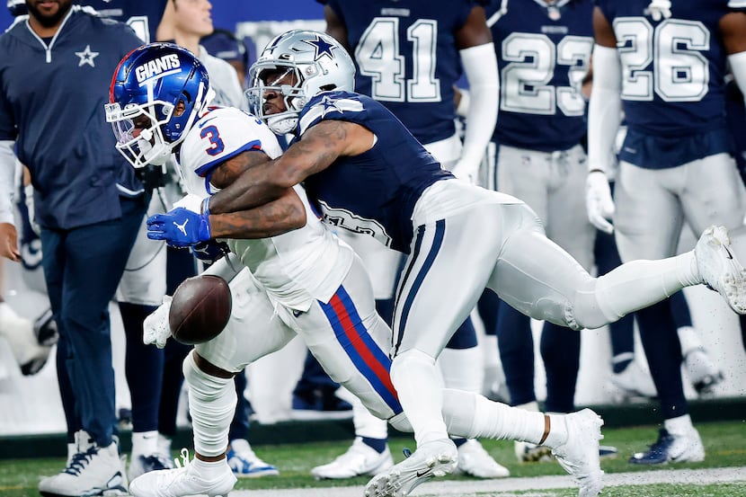 Dallas Cowboys cornerback Anthony Brown (3) breaks up a pass nearly caught by New York...