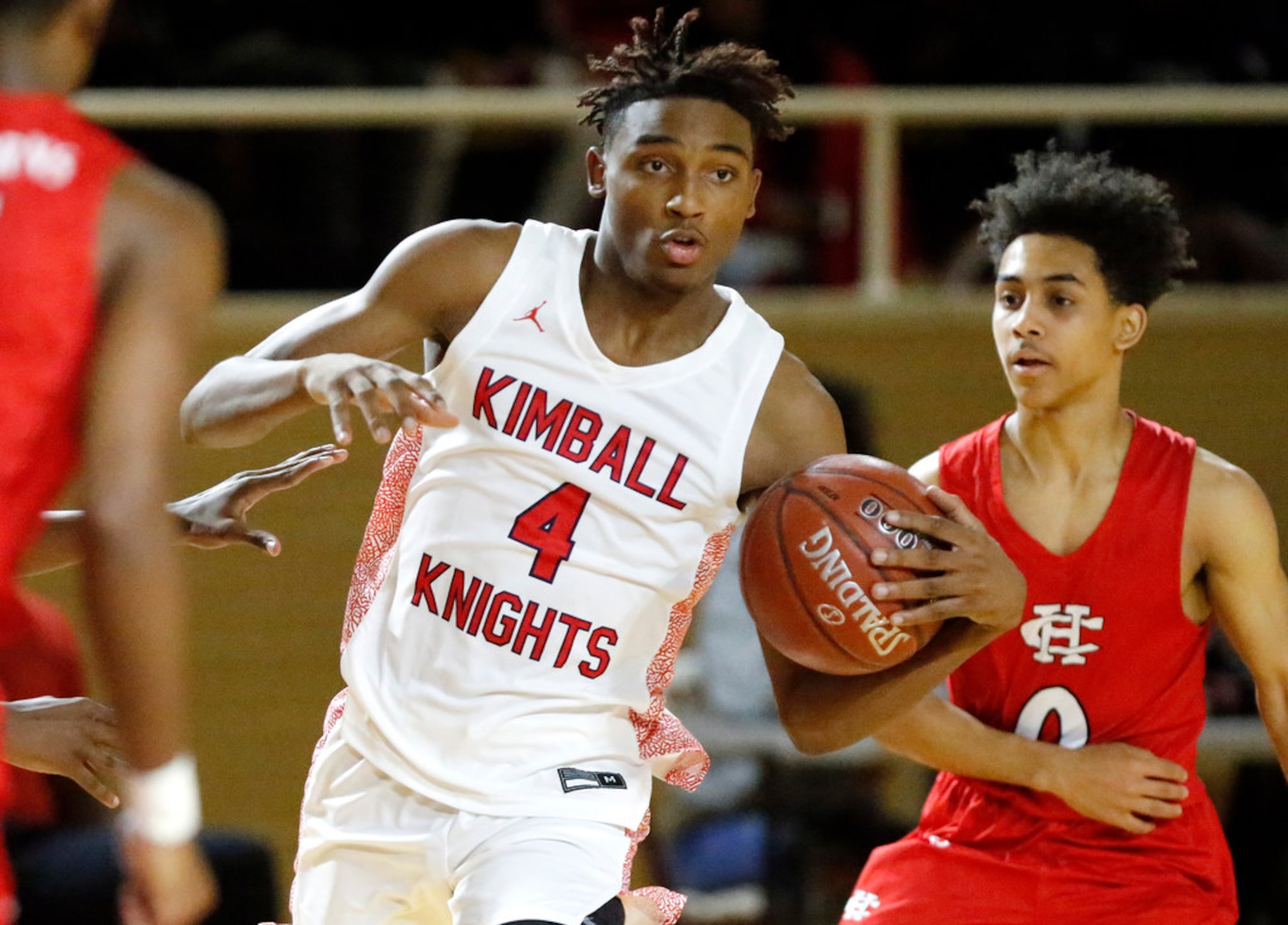 Kimball High School guard Arterio Morris (4) prepares to pass during the first half as...