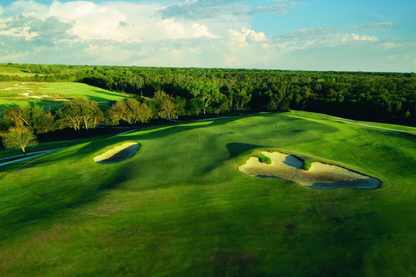 The third and 11th holes at Trinity Forest Golf Club in Dallas share a green that is roughly...