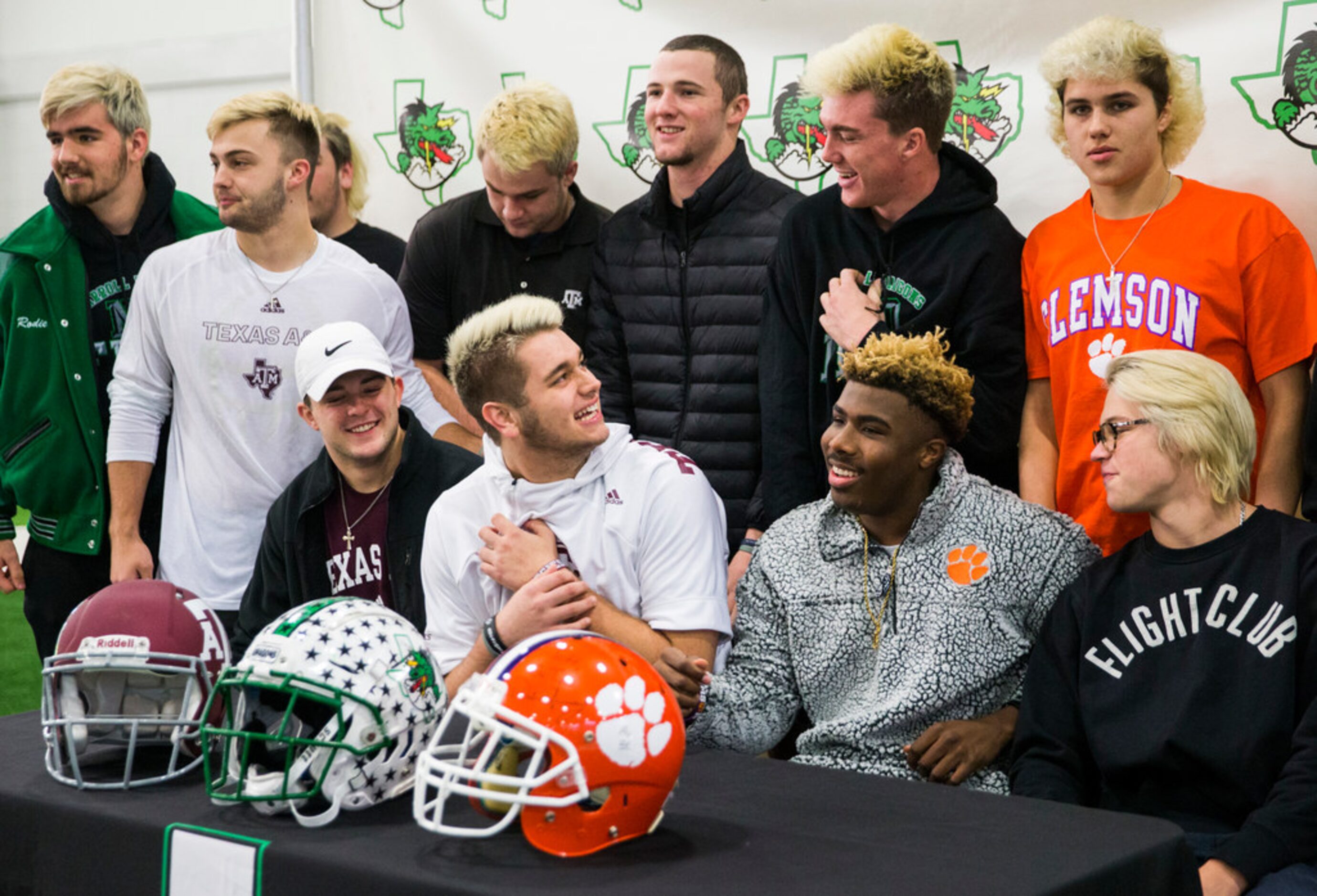 Southlake Carroll football players tease their team mates Blake Smith (bottom center) and RJ...