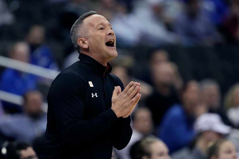 Texas Tech head coach Grant McCasland talked to his players during the first half of an NCAA...