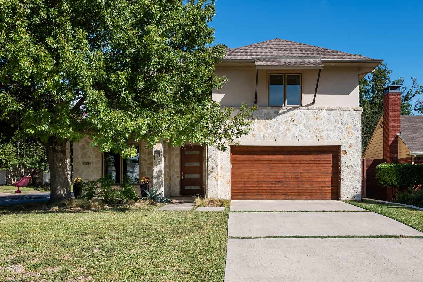 The exterior of the home features a stone facade.