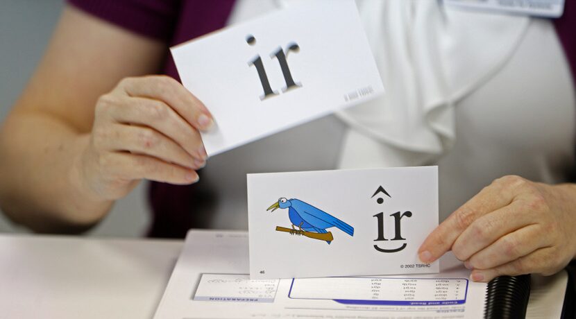 Dachia Kearby shows pronunciation cues on flash cards in the dyslexia center at Texas...