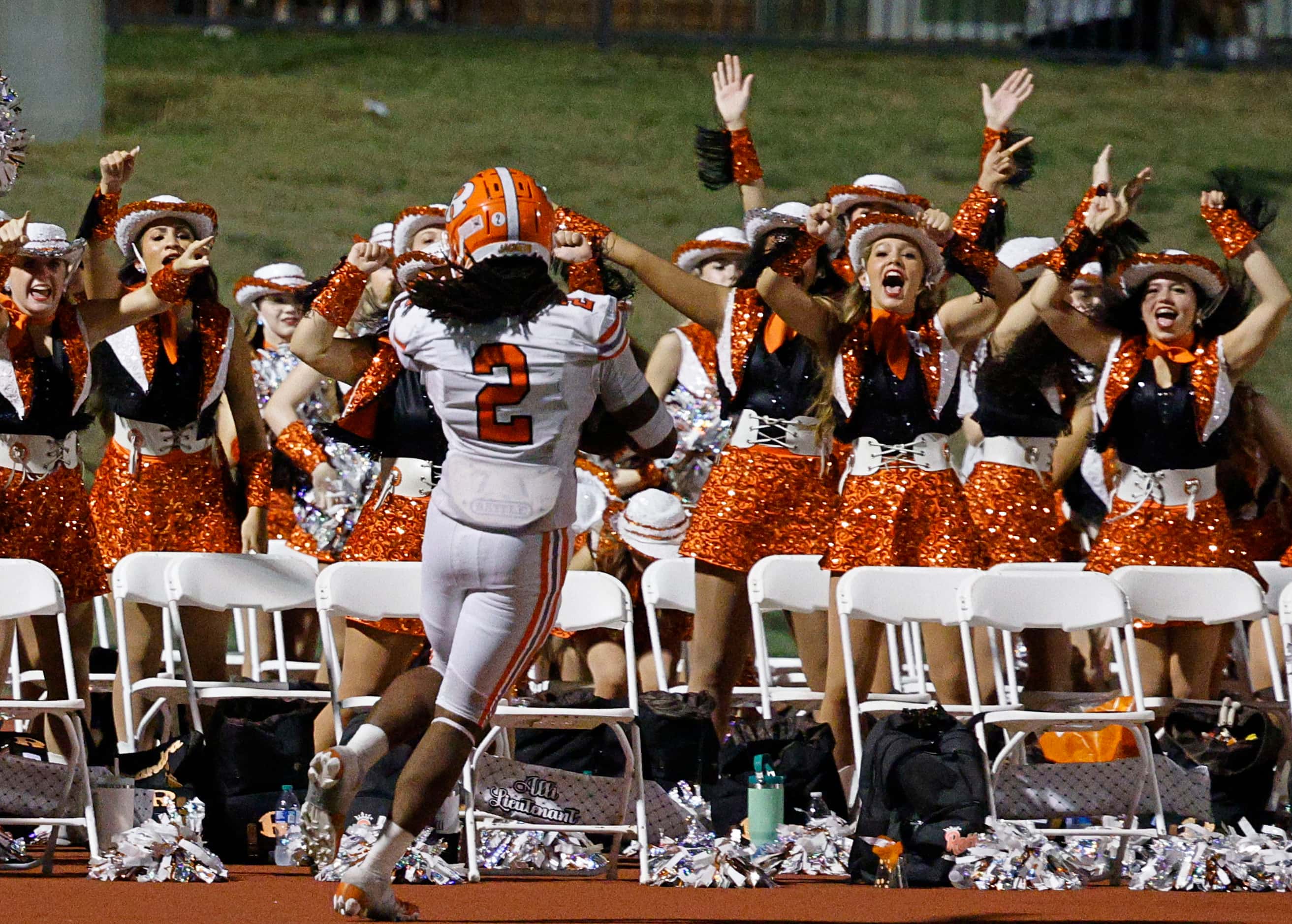 Rockwall's Ashten Emory (2) celebrates after scoring a touchdown during the second half of a...