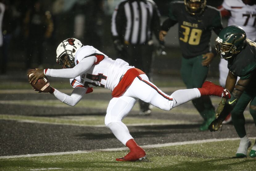 Cedar Hill's Christian Hallmon (24) dives in for a touchdown against DeSoto in the first...