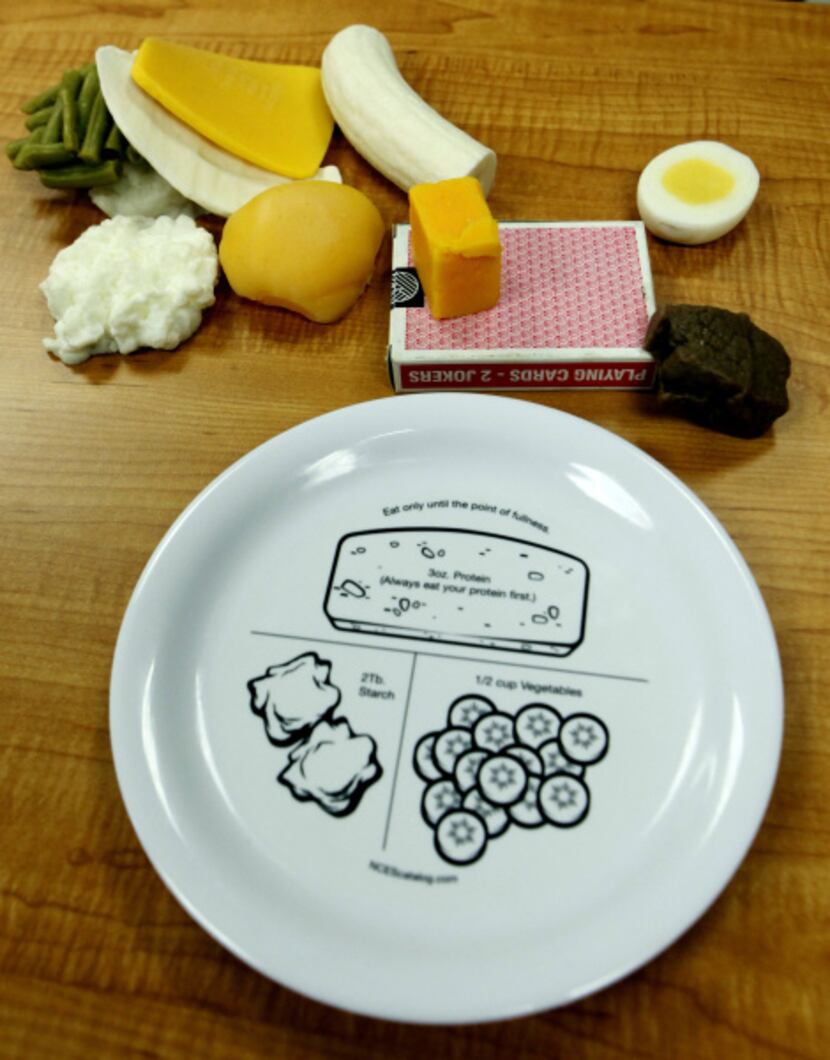 A salad plate is used to demonstrate proper serving sizes at the Weight Management Institute...